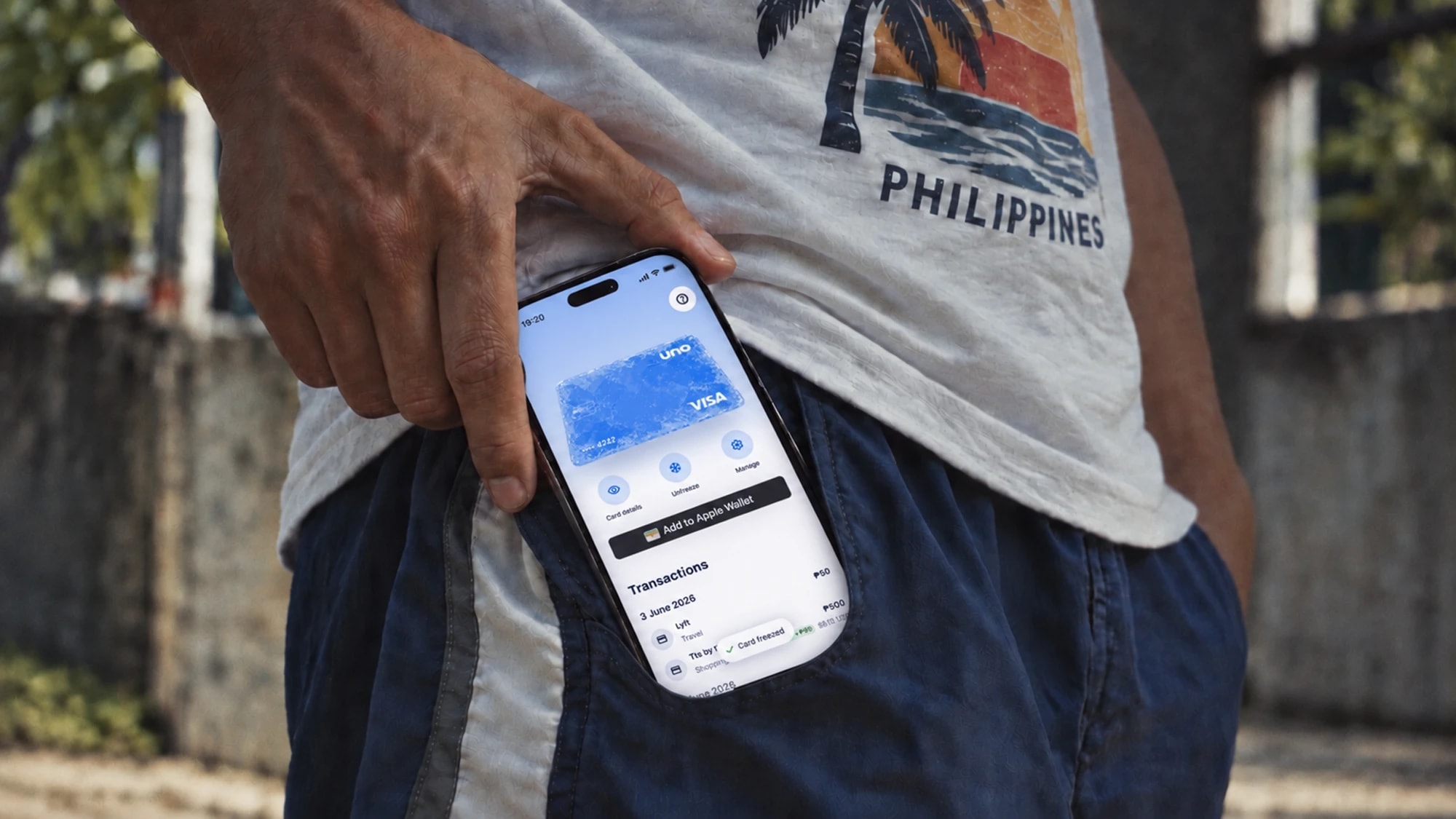 Uno card screen on a phone slipping into a pocket